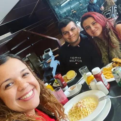 Elida López with her clients celebrating the handover of their home
