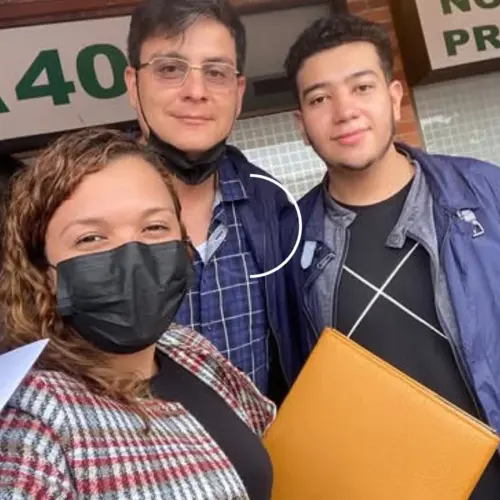 Elida López with her clients celebrating the handover of their home