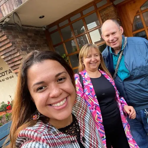 Elida López with her clients celebrating the handover of their home